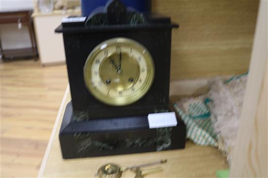 A slate mantel clock with key and pendulum height 29cm